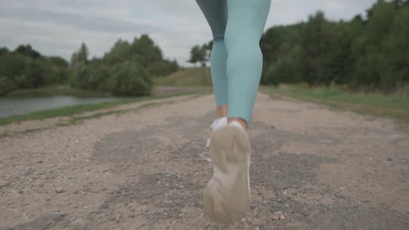 Close Up Leg Running Women Wear Sneaker Start to Run on the Road