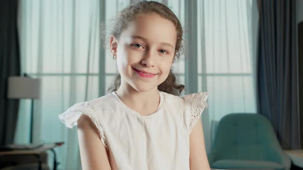 Portrait Funny Little Girl Smiling Child Looking at Camera are Sitting on the Couch at Home Cute Kid