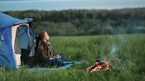 Active Woman Tourist Having Halt After Trekking Day Sit Near Bonfire