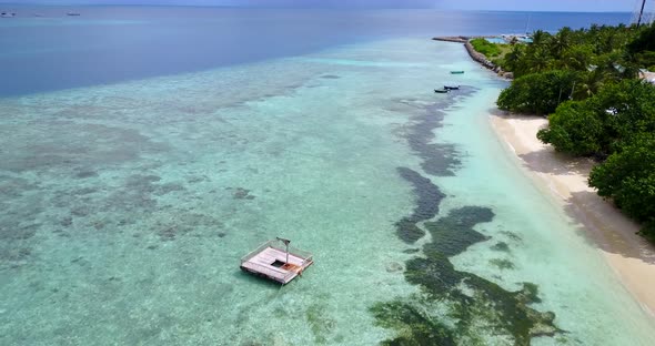 Wide aerial tourism shot of a white paradise beach and aqua turquoise water background in high resol