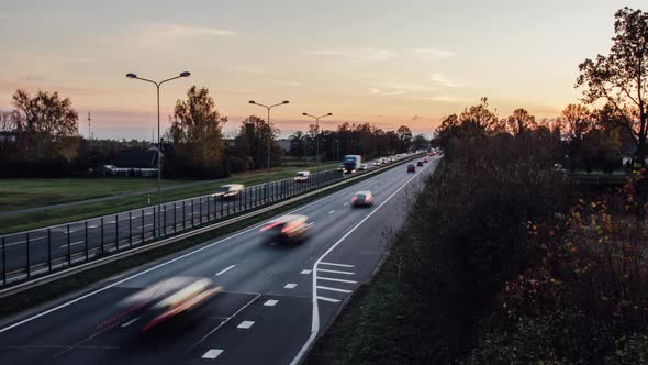 Dusk with highway traffic in the foreground.