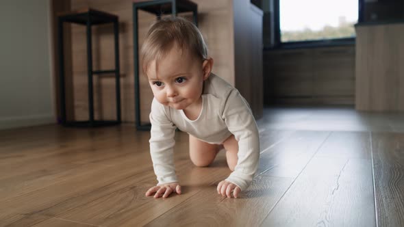 Video of little girl crawling at home interior. Shot with RED helium camera in 8K.