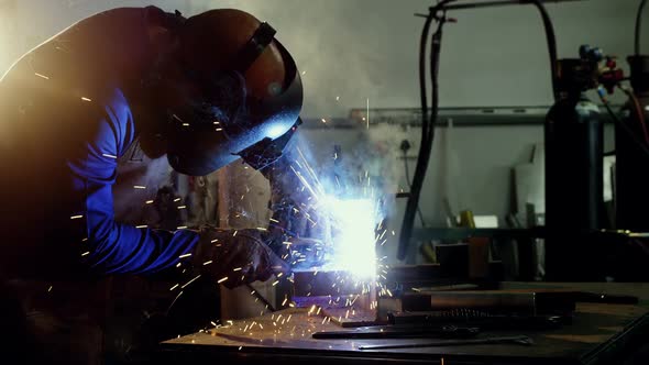 Welder welding a metal