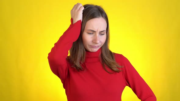 Young Woman Isolated on Yellow Background in Studio