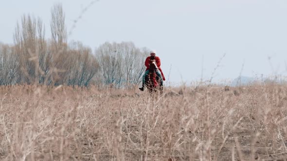 A Man Riding a Horse