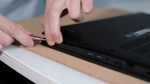 Unrecognizable Engineer Separating Computer From Case