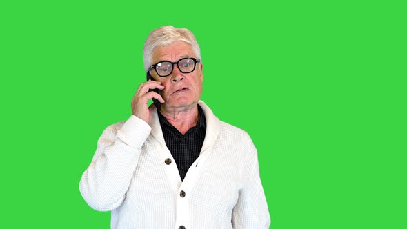 Angry Senior Man Making a Call on a Green Screen Chroma Key