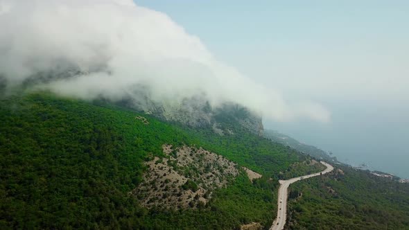 Drones Eye View - Winding Road From the High Mountain Pass To Crimea. Great Road Trip