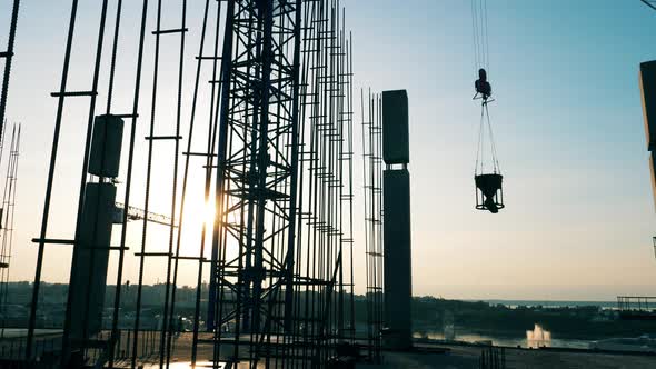 Crane Moves Construction Parts While Building a House