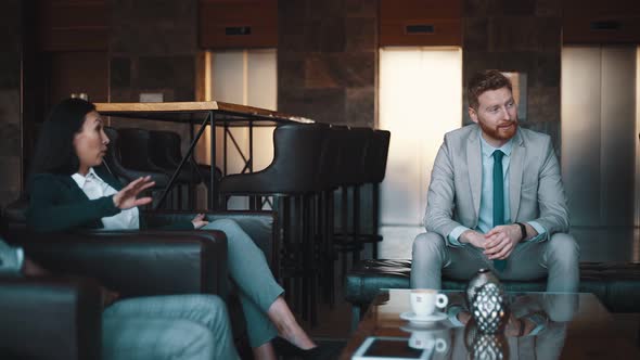 Business peoble during meeting in a lobby of a hotel