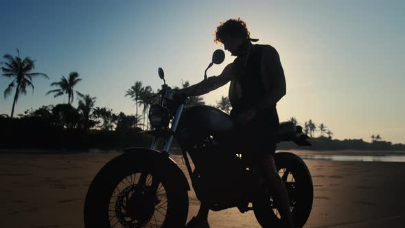 Biker on the Beach at Sunset