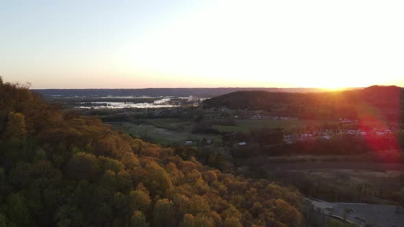 Sunset view over Mississippi River valley in Wisconsin in autumn. Farm fields and homes seen.