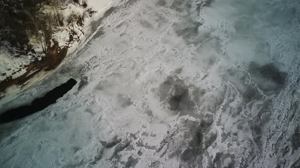 Calm Frozen River Covered with Ice on Cold Winter Day