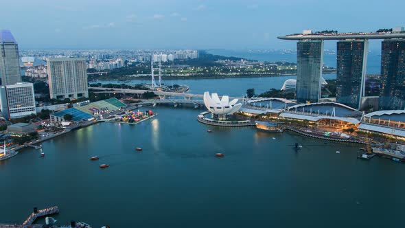 Beautiful Time Lapse of Day To Night of Singapore Skyline From with Reflection