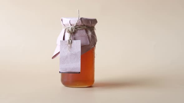 Fresh Honey in a Glass Jar with a Paper Empty Label