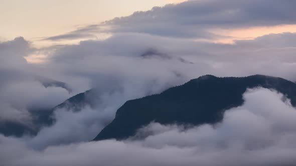 The High Mountains Are Covered With Dense Clouds