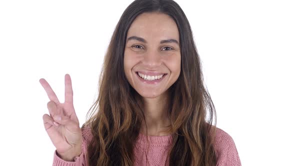 Victory Sign By Young Latin Girl White Background