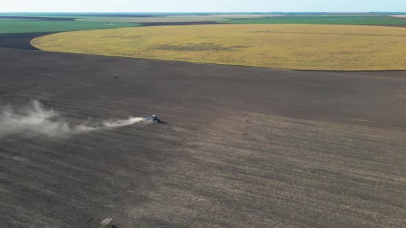 Agricultural Tractor Performing Fall Tillage in Stubble Field