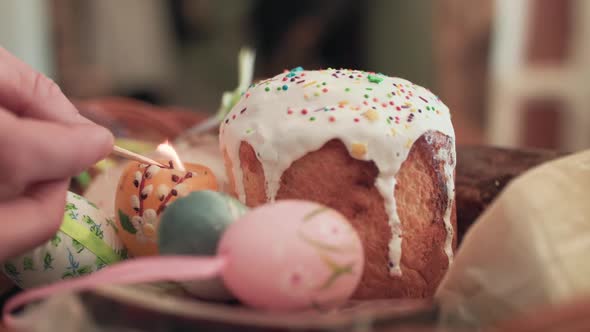 Beautiful Easter Basket with Cake, Eggs and Light Candle