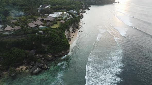 Beautiful Bingin beach with exotic cliffs houses and hotel located in Bali, Indonesia. This drone fo