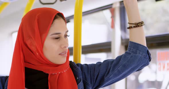 Woman in Hijab Standing While Travelling in The Bus 4k