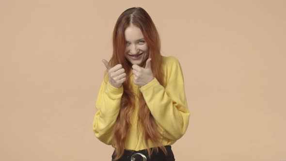 Cheerful Charismatic Redhead Hipster Girl Ginger Long Hair Jumping From Bottom Appear on Yellow