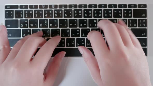 Close up female hands and fingers in top view on desk