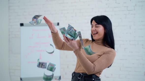 Happy business woman with dollar banknotes. 