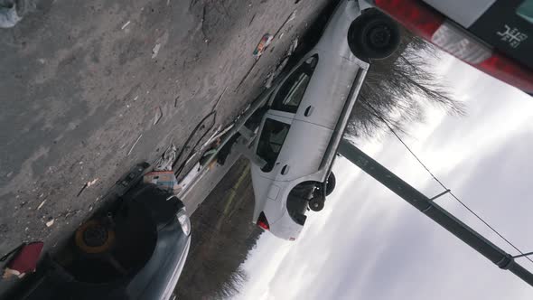 Overturned and Broken Cars on the Road