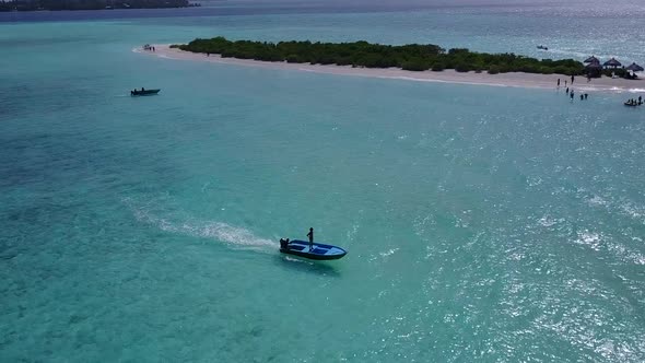 Wide angle tourism of lagoon beach wildlife by clear lagoon with sand background before sunset