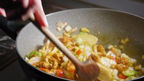 Removing Glass Lid Cover And Stir Chicken And Vegetables Cooking In A Pan. Quick One Bowl Meal Recip