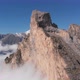 Aerial Shot of Flying Over the Mountain Peaks Among the Clouds - VideoHive Item for Sale