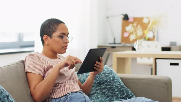 African American Woman with Tablet Pc at Home