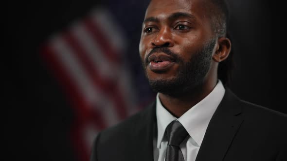 Closeup Portrait of Confident African American Male Politician Diplomat Answering Questions at News