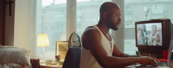 Black Man Working on Laptop at Home