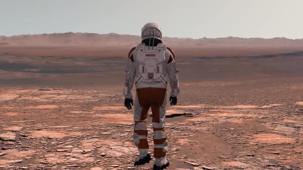 Astronaut Wearing Space Suit Walking on the Surface of Mars