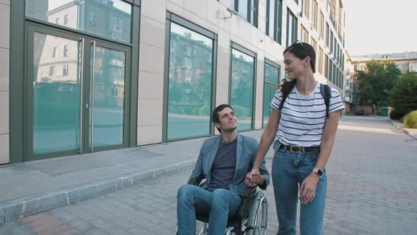 Disabled person in a wheelchair with a girlfriend