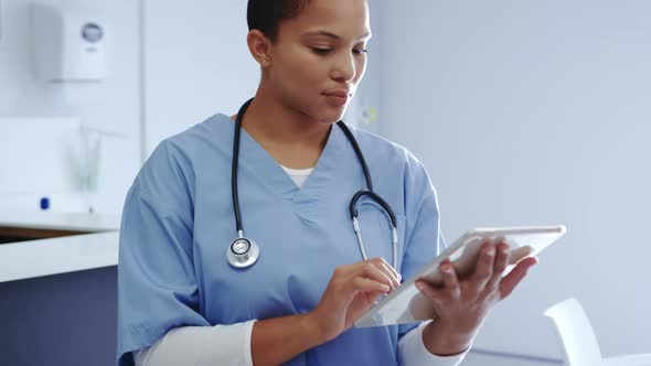 Female doctor using digital tablet in hospital 4k