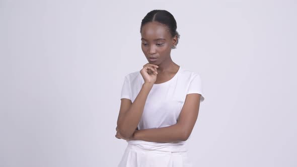 Young African Woman Looking Serious While Thinking