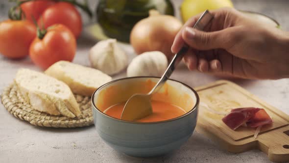 Person eating salmorejo with ham and bread, Eating Time Lapse