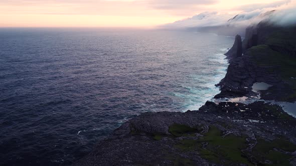 Scenic aerial view of a cliff on North Atlantic sea, Faroe island.