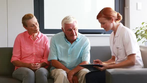 Nurse have discussion with her senior patients