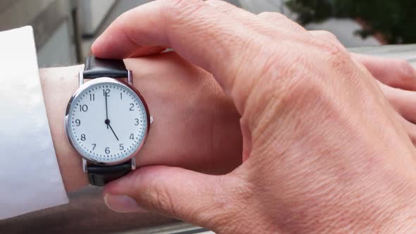 Businessman checking the time