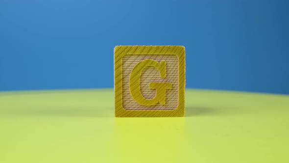 Close up shot letter "G" alphabet wooden block