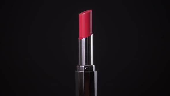 Red Lipstick Isolated on Black Background