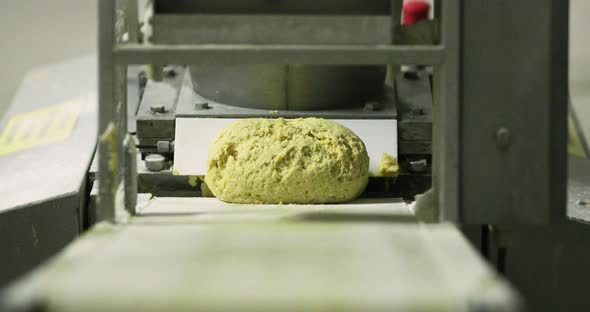 Bread Loaf Dough Divider Machine - Cut Dough On The Moving Conveyor - selective focus
