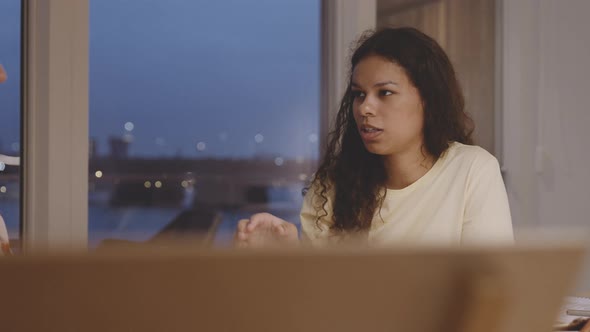 Female University Student In Discussion At Table