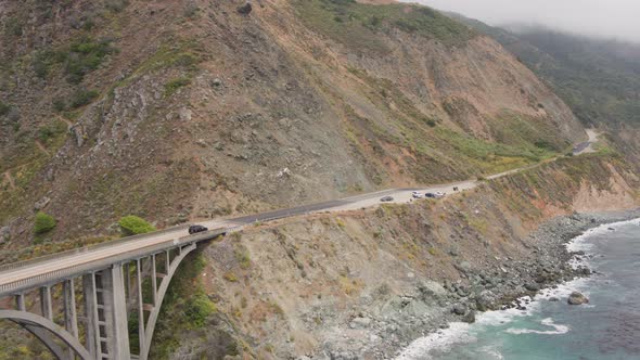 Aerial Drone Shot of a Bridge and Overlook a Steep Coastal Road (Big Sur, Pacific Coast Highway, CA)