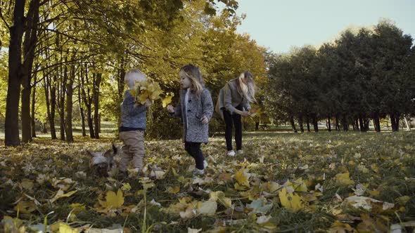 Happy Family Portrait in Autumn Park