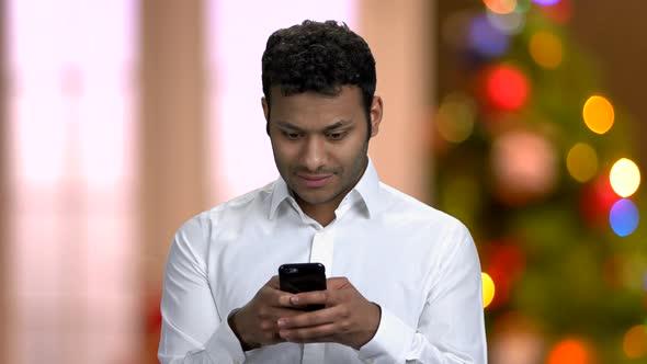 Handsome Man Typing Message on Cell Phone